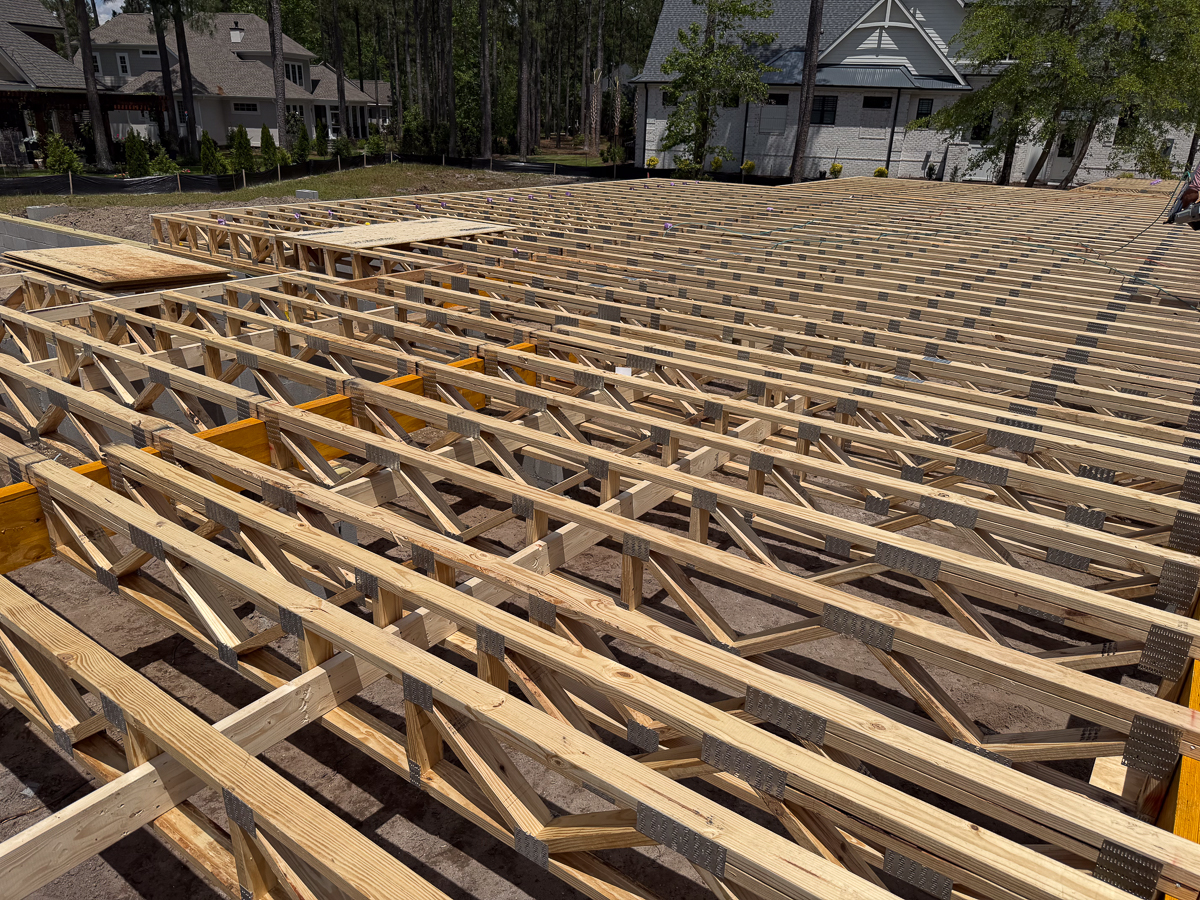 Wide view of engineered floor truss system installed for a new coastal home
