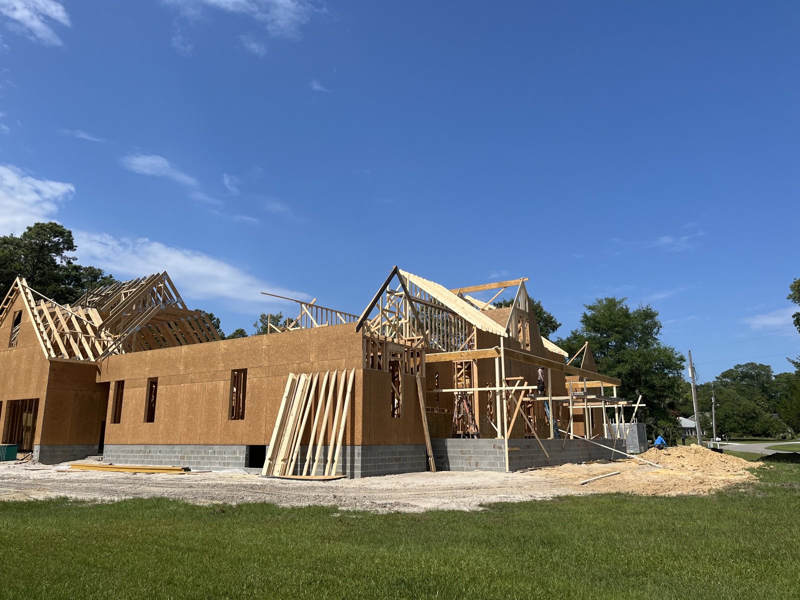 New home framing project under a blue coastal Carolina sky